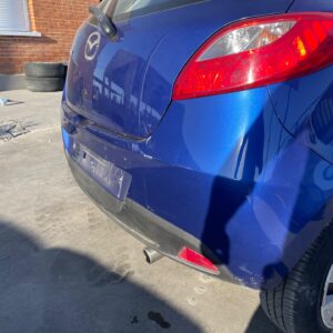 PARAGOLPES TRASERO MAZDA 2 BERLINA (DE)